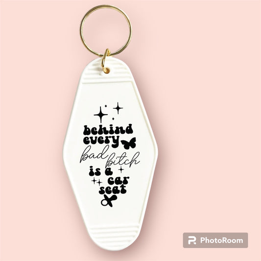 Behind every bad b is a car seat-UVDTF Keychain Decal